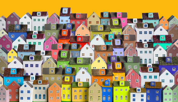   Stadthintergrund mit Reihen von bunten Holzhäusern © Adobe Stock, Soho A studio