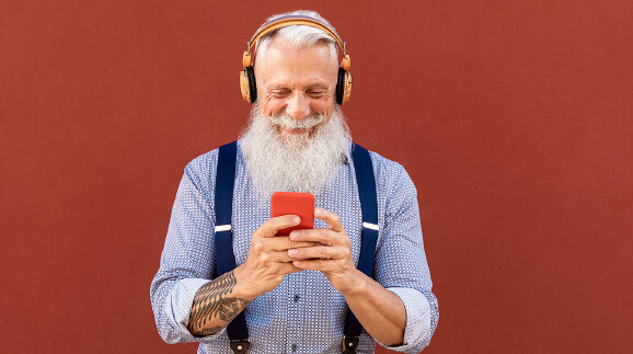 Senior hipster man using mobile smartphone