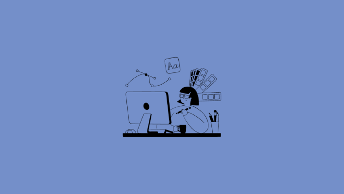 Person am PC mit Tasse und B&uuml;romaterial